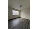 Simple bedroom with new flooring and a window at 521 S Maryland Pkwy # A10, Las Vegas, NV 89101