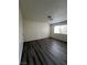 Bright bedroom with dark gray laminate flooring and neutral walls at 521 S Maryland Pkwy # A10, Las Vegas, NV 89101