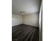 Bright bedroom with dark gray laminate flooring and neutral walls at 521 S Maryland Pkwy # A10, Las Vegas, NV 89101