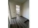 Clean hallway with grey flooring and access to bathroom at 521 S Maryland Pkwy # A10, Las Vegas, NV 89101