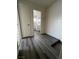 Clean hallway with grey flooring and access to bathroom and bedrooms at 521 S Maryland Pkwy # A10, Las Vegas, NV 89101