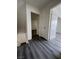 Clean and bright hallway with grey flooring and access to bedrooms at 521 S Maryland Pkwy # A10, Las Vegas, NV 89101