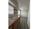 Kitchen with wooden cabinets and view to living room at 521 S Maryland Pkwy # A10, Las Vegas, NV 89101