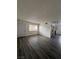 Open living room with gray flooring and access to entryway at 521 S Maryland Pkwy # A10, Las Vegas, NV 89101