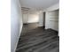 Modern living room with gray laminate floors and open staircase at 521 S Maryland Pkwy # A10, Las Vegas, NV 89101
