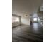 Open concept living room with gray flooring and staircase at 521 S Maryland Pkwy # A10, Las Vegas, NV 89101
