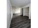 Gray vinyl flooring and a staircase in this living room at 521 S Maryland Pkwy # A10, Las Vegas, NV 89101