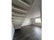 Living room with gray flooring and a modern staircase at 521 S Maryland Pkwy # A10, Las Vegas, NV 89101