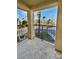 Private balcony overlooks a landscaped courtyard with palm trees and distant mountain views at 5960 Palmilla St # 3, North Las Vegas, NV 89031
