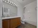 Clean bathroom with wood vanity and a shower/tub combo at 5960 Palmilla St # 3, North Las Vegas, NV 89031