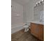 Bathroom with a tub, toilet, and wood vanity at 5960 Palmilla St # 3, North Las Vegas, NV 89031