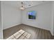 Bright bedroom with hardwood flooring and large window at 5960 Palmilla St # 3, North Las Vegas, NV 89031