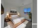 Spacious bedroom with large window and wood flooring at 5960 Palmilla St # 3, North Las Vegas, NV 89031