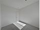 Spacious bedroom with a closet and carpet flooring at 5960 Palmilla St # 3, North Las Vegas, NV 89031