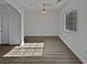 Spacious dining area with light wood flooring and large window at 5960 Palmilla St # 3, North Las Vegas, NV 89031