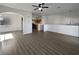Open living room with high ceiling and wood-look flooring at 5960 Palmilla St # 3, North Las Vegas, NV 89031