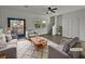 Bright living room with patio access and hardwood floors at 5960 Palmilla St # 3, North Las Vegas, NV 89031