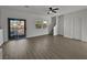 Spacious living room with hardwood floors and sliding glass doors at 5960 Palmilla St # 3, North Las Vegas, NV 89031
