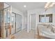 Main bath with double vanity, shower, and mirrored closet at 6650 Apollos Gate Ct, Las Vegas, NV 89142