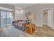 Living room with gray sofa and wood flooring at 700 Carnegie St # 2313, Henderson, NV 89052