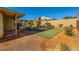 Backyard with playground and artificial turf at 7260 Fruitful Harvest Ave, Las Vegas, NV 89131