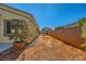 Landscaped backyard with block wall at 7260 Fruitful Harvest Ave, Las Vegas, NV 89131