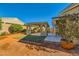 Backyard with covered patio and landscaping at 7260 Fruitful Harvest Ave, Las Vegas, NV 89131