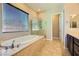 Bathroom boasts a large soaking tub and walk-in shower at 7260 Fruitful Harvest Ave, Las Vegas, NV 89131