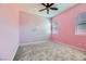 Charming bedroom with pink walls, ceiling fan, and window blinds at 7260 Fruitful Harvest Ave, Las Vegas, NV 89131