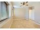 Well-lit bedroom with tile floors and ceiling fan at 7260 Fruitful Harvest Ave, Las Vegas, NV 89131