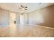 Large bedroom with tile floors and access to bathroom at 7260 Fruitful Harvest Ave, Las Vegas, NV 89131