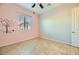 Pastel bedroom with ceiling fan and window coverings at 7260 Fruitful Harvest Ave, Las Vegas, NV 89131