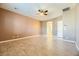 Bright bedroom with tile floors and ensuite bathroom at 7260 Fruitful Harvest Ave, Las Vegas, NV 89131