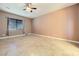 Spacious bedroom with tile floors and ceiling fan at 7260 Fruitful Harvest Ave, Las Vegas, NV 89131