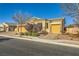 Single-story home with a stone and stucco exterior, two-car garage, and landscaped front yard at 7260 Fruitful Harvest Ave, Las Vegas, NV 89131