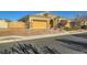 Single-story home with a stone and stucco exterior, two-car garage, and landscaped front yard at 7260 Fruitful Harvest Ave, Las Vegas, NV 89131
