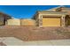 Two-car garage with decorative gates and brick driveway at 7260 Fruitful Harvest Ave, Las Vegas, NV 89131
