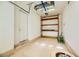 Garage with built-in shelving and flooring at 7260 Fruitful Harvest Ave, Las Vegas, NV 89131