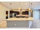 Kitchen boasts granite countertops and dark wood cabinetry at 7260 Fruitful Harvest Ave, Las Vegas, NV 89131