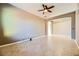 Bright living room with tile floors and a ceiling fan at 7260 Fruitful Harvest Ave, Las Vegas, NV 89131