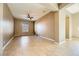 Spacious living room featuring tile floors and a ceiling fan at 7260 Fruitful Harvest Ave, Las Vegas, NV 89131