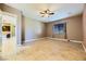 Living room with tile floors and view to kitchen at 7260 Fruitful Harvest Ave, Las Vegas, NV 89131