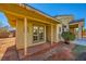 Covered patio with double doors and tile flooring at 7260 Fruitful Harvest Ave, Las Vegas, NV 89131