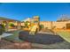 playground with slide and swings at 7260 Fruitful Harvest Ave, Las Vegas, NV 89131