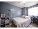 Cozy bedroom with double bed and gray walls at 7670 Isley Ave, Las Vegas, NV 89147