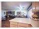 Kitchen features a breakfast bar overlooking the living and dining area at 7670 Isley Ave, Las Vegas, NV 89147