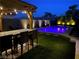 Lighted patio with pool and bar area at 7926 Elk Mountain St, Las Vegas, NV 89113