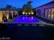 Night view of a relaxing pool and spa at 7926 Elk Mountain St, Las Vegas, NV 89113