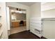 Bright bathroom with double vanity and view of the walk-in closet at 8032 Deep Stone Ave, Las Vegas, NV 89149