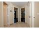 Well-lit hallway with doors leading to bedrooms and bathroom at 8032 Deep Stone Ave, Las Vegas, NV 89149